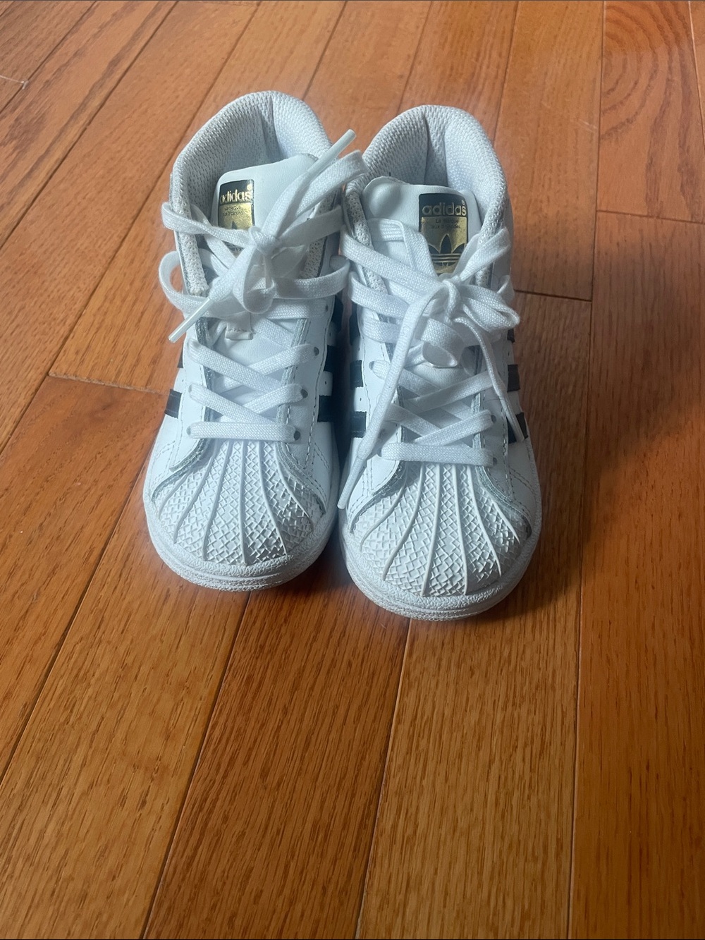 adidas Kids White Sneakers with Black Stripes and Gold Tongue Logo